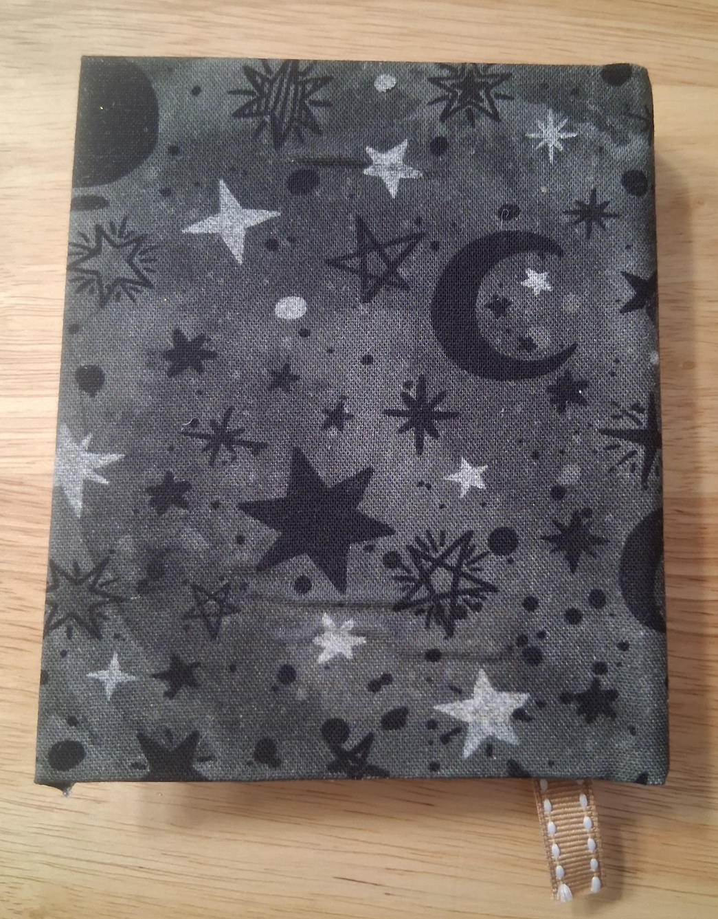 Celestial-patterned back cover of small handmade journal